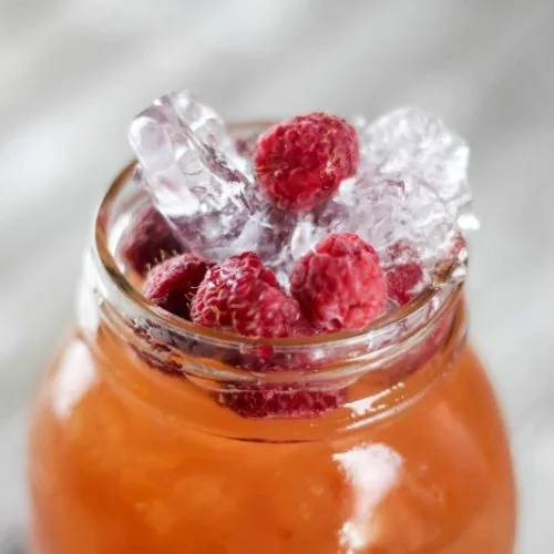 Spiked Raspberry Lemonade Ice Tea | Here's a super quick summer cocktail using a wine cooler as your mixer. Find the recipe on Today's Creative Life