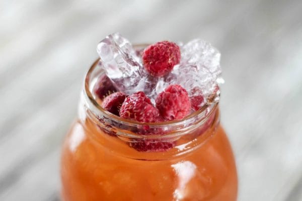 Spiked Raspberry Lemonade Ice Tea | Here's a super quick summer cocktail using a wine cooler as your mixer. Find the recipe on Today's Creative Life