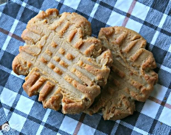 soft and chewy peanut butter cookies on a plaid napkin