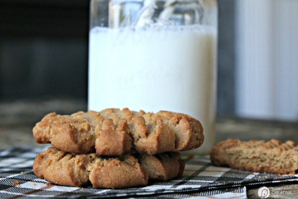 chewy peanut butter cookies next to a glass of milk