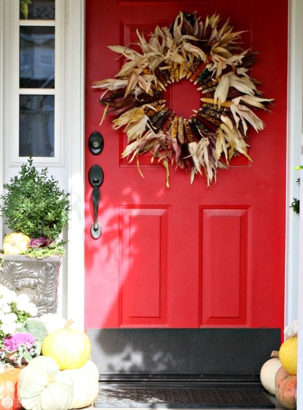 DIY Indian Corn Wreath Fall Porch | Create a fall porch that will welcome your guests in style. DIY Fall Decor is easier than you think. See more by clicking the photo. TodaysCreativeLife.com