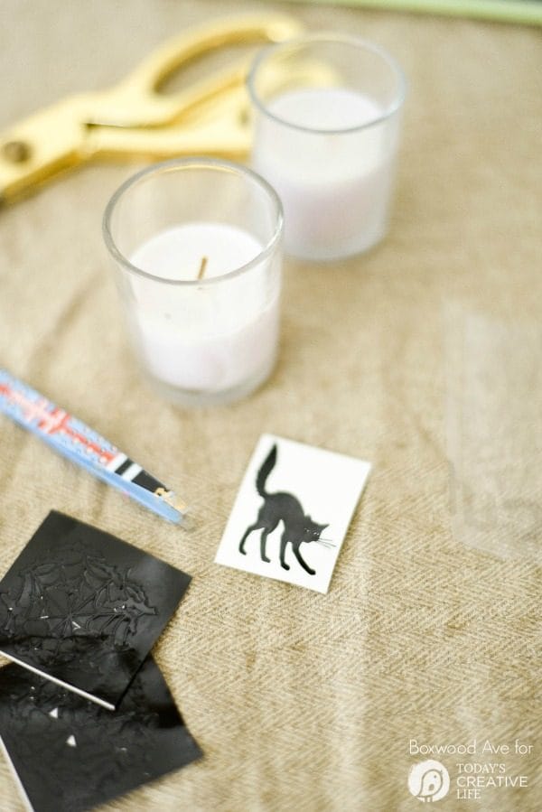 DIY Halloween Votives | Create your own DIY Halloween Decor with this simple craft. Using a Cricut Explore or an Xacto knife for your design. Click the photo for a full tutorial. TodaysCreativeLife.com