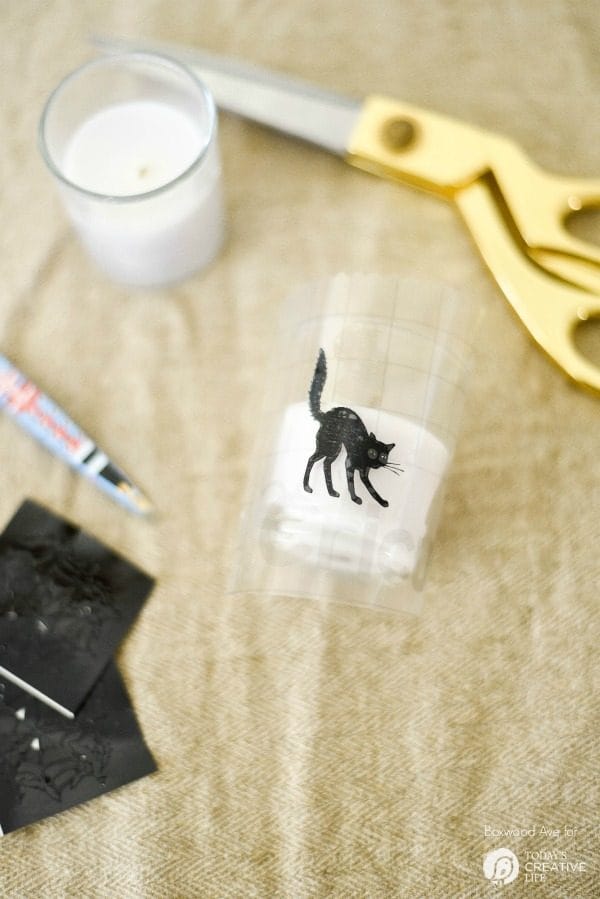 DIY Halloween Votives | Create your own DIY Halloween Decor with this simple craft. Using a Cricut Explore or an Xacto knife for your design. Click the photo for a full tutorial. TodaysCreativeLife.com