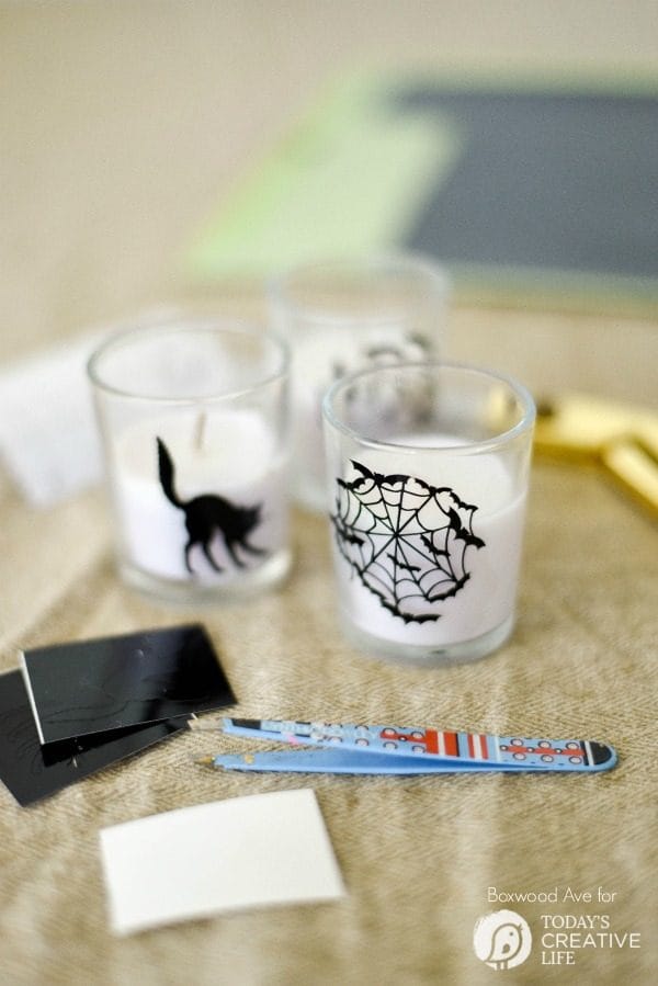 DIY Halloween Votives | Create your own DIY Halloween Decor with this simple craft. Using a Cricut Explore or an Xacto knife for your design. Click the photo for a full tutorial. TodaysCreativeLife.com