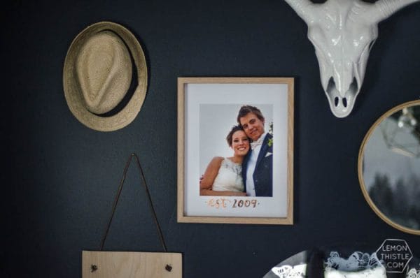 DIY Copper Foiled Photo Mat - What a perfect way to customize a standard photo frame! Hand lettered, foiled, and totally personal- this would make a great wedding gift! Love that it doesn't take a foiling machine