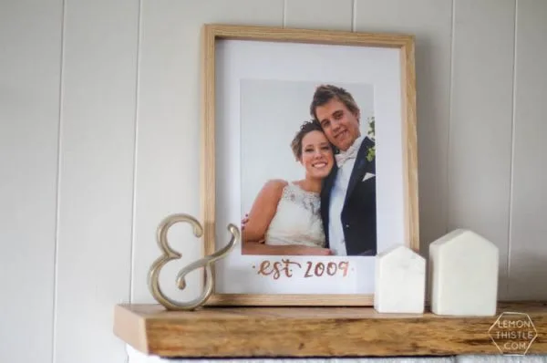 DIY Copper Foiled Photo Mat - What a perfect way to customize a standard photo frame! Hand lettered, foiled, and totally personal- this would make a great wedding gift! Love that it doesn't take a foiling machine