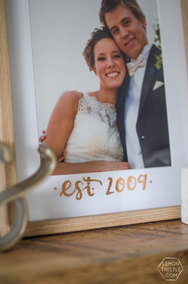 DIY Copper Foiled Photo Mat - What a perfect way to customize a standard photo frame! Hand lettered, foiled, and totally personal- this would make a great wedding gift! Love that it doesn't take a foiling machine