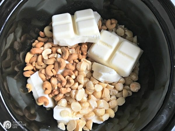 Crock Pot Candy | this white chocolate cashew & macadamia nut clusters are easily made right in your slow cooker! Makes a great holiday gift. See more on TodaysCreativeLife.com