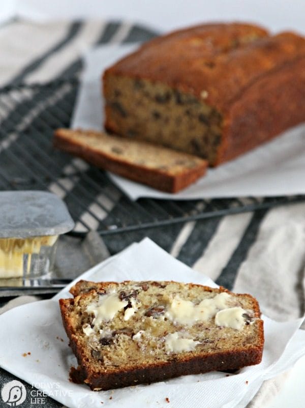 slice of warm banana bread with butter melting on top