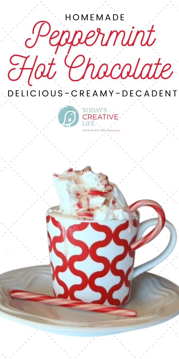 Red and White mug of homemade peppermint hot chocolate with whipped topping