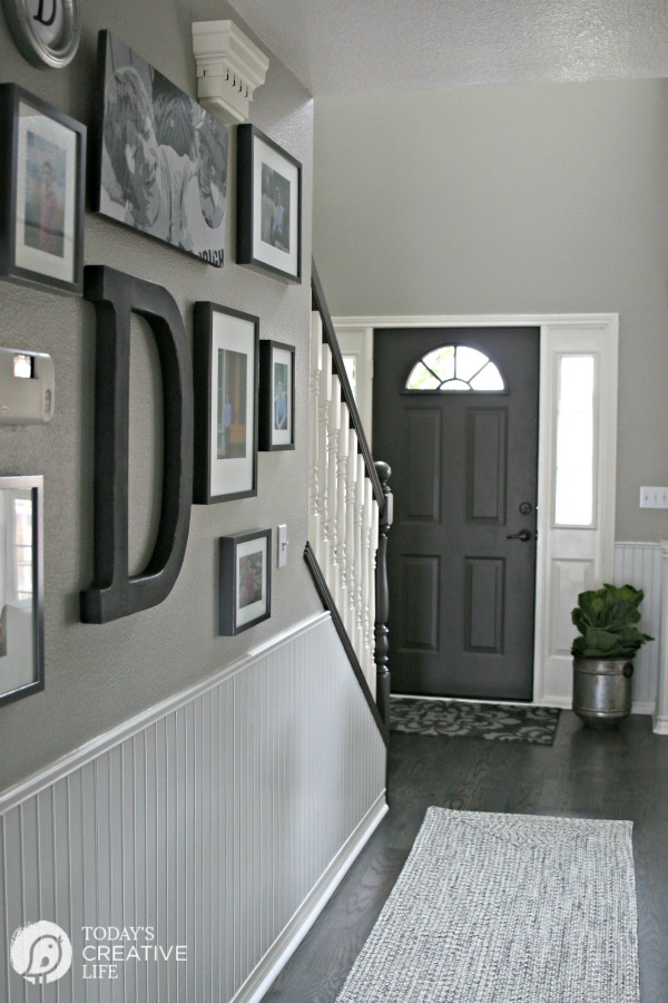 photos and art hung in a hallway