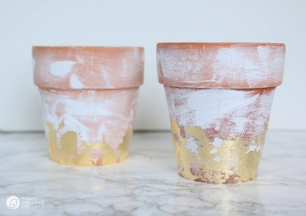 DIY Distressed Gold Leaf Terracotta Pots - How to age a terracotta pot. How to add gold leaf to a terracotta flower pot. 