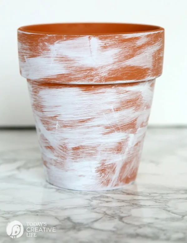 DIY Distressed Gold Leaf Terracotta Pots | How to age a terracotta flower pot with paint. 