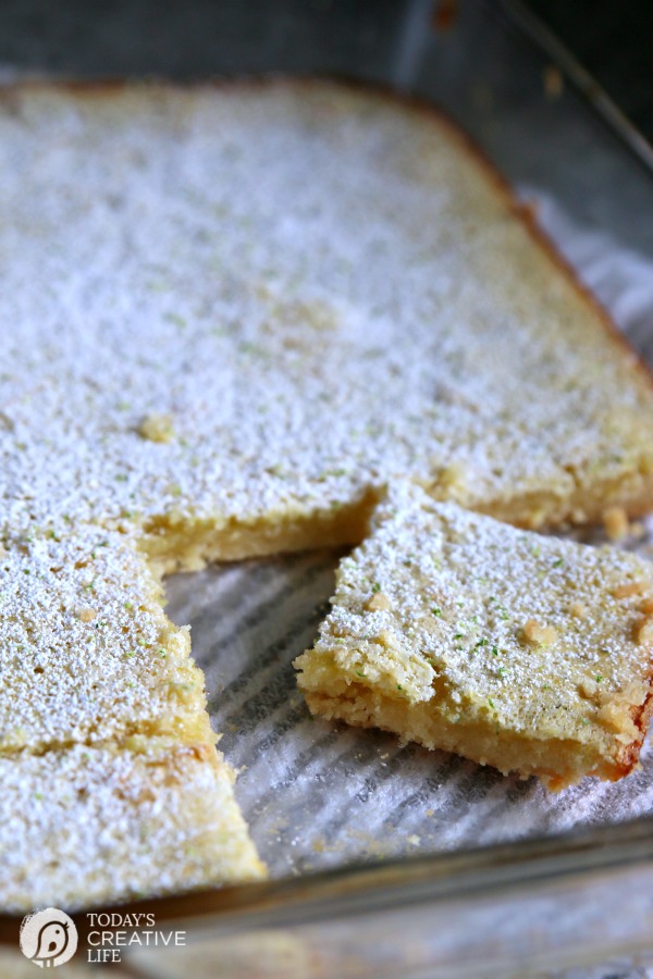 Key Lime Bars | Like Lemon bars, this classic Key Lime Bar recipe packs a pucker! This spring time dessert is great for Easter, bake sales, and picnics! Click the photo to find the recipe. TodaysCreativeLife.com