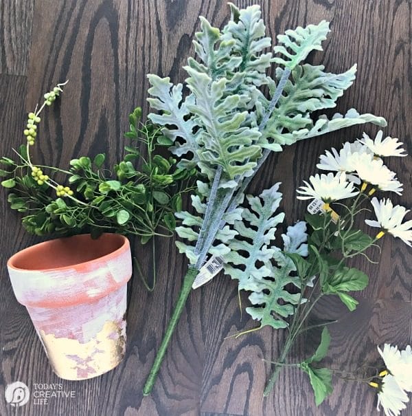 Table Centerpiece Ideas | How to use artificial greens and flowers for perfect everyday decorating for your home. Simple DIY & inexpensive. Easy to create this spring centerpiece in 10 minutes. See more on TodaysCreativeLife.com