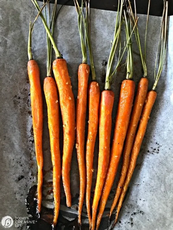 Honey Roasted Carrots with Garlic are savory and sweet. Perfect side dish any time of year. Holiday side dish, Easter Side Dish, vegetable side dish. Click the photo for the recipe. TodaysCreativelife.com