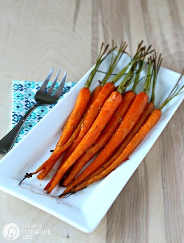 Honey Roasted Carrots with Garlic are savory and sweet. Perfect side dish anytime of year. Holiday side dish, Easter Side Dish, vegetable side dish. Click the photo for the recipe. TodaysCreativelife.com