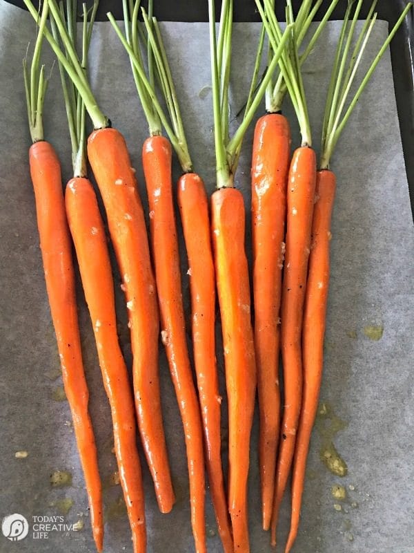 Honey Roasted Carrots with Garlic are savory and sweet. Perfect side dish anytime of year. Holiday side dish, Easter Side Dish, vegetable side dish. Click the photo for the recipe. TodaysCreativelife.com