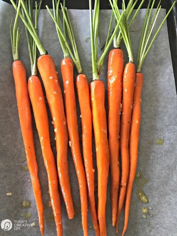 Honey Roasted Carrots with Garlic are savory and sweet. Perfect side dish anytime of year. Holiday side dish, Easter Side Dish, vegetable side dish. Click the photo for the recipe. TodaysCreativelife.com