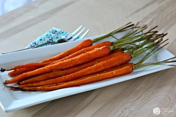 Honey Roasted Carrots with Garlic are savory and sweet. Perfect side dish anytime of year. Holiday side dish, Easter Side Dish, vegetable side dish. Click the photo for the recipe. TodaysCreativelife.com