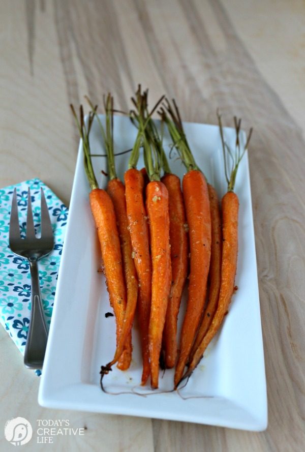 Honey Roasted Carrots with Garlic are savory and sweet. Perfect side dish anytime of year. Holiday side dish, Easter Side Dish, vegetable side dish. Click the photo for the recipe. TodaysCreativelife.com