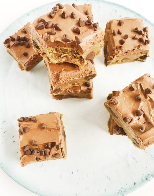 overhead image of frosted peanut butter chocolate chip brownies