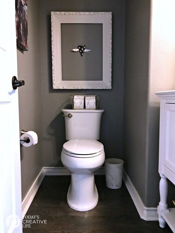 toilet area in a small bathroom