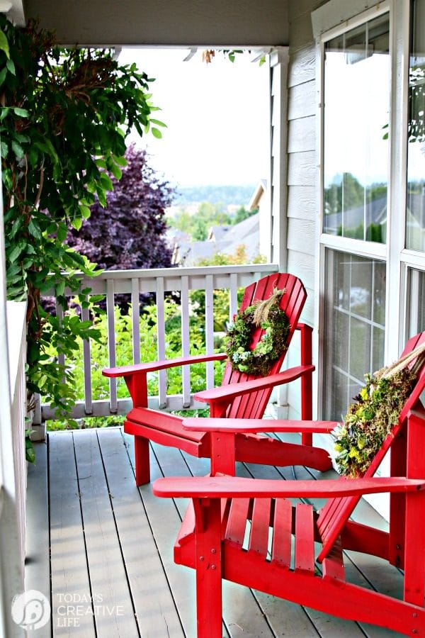 two red wooden deck chairs