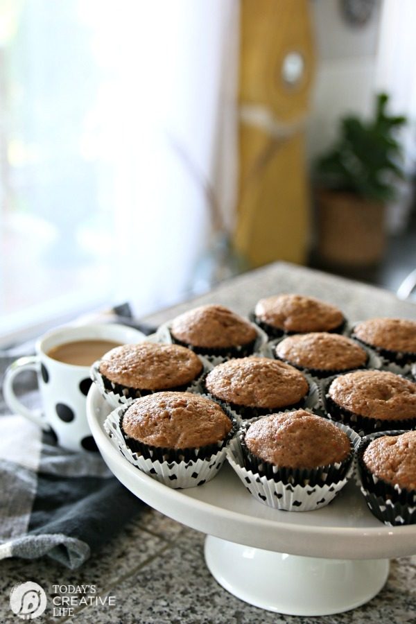 golden brown muffins on white cake plate