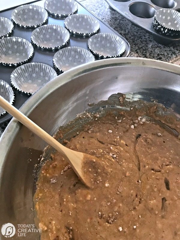 Carrot Banana Walnut Muffins Recipe being mixed in a large mixing bowl. 