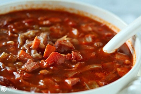 Red Cabbage Kielbasa White Bean Soup | Hearty Soup Recipes for easy dinner ideas. Simple vegetable soup with kielbasa sausage | Click for the recipe on TodaysCreativeLife.com AD #AuntNelliesSweetSourCabbage 