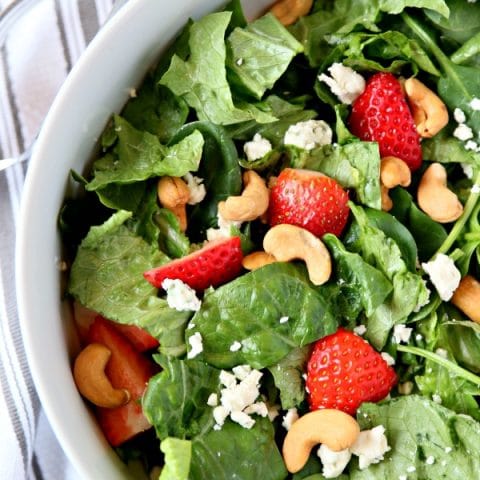 Strawberry Gorgonzola Salad with Cashews | Toped with homemade vinaigrette, loaded with spinach, romaine and Flavor!