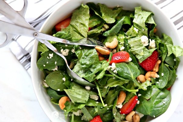 Strawberry Gorgonzola Salad with Cashews | Topped with homemade vinaigrette, loaded with spinach, romaine and Flavor!