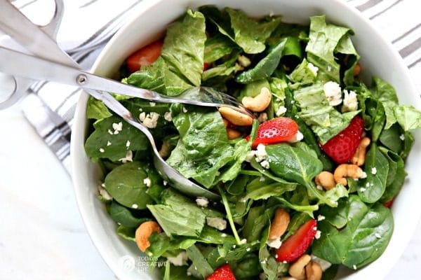 Strawberry Gorgonzola Salad with Cashews | Topped with homemade vinaigrette, loaded with spinach, romaine and Flavor!