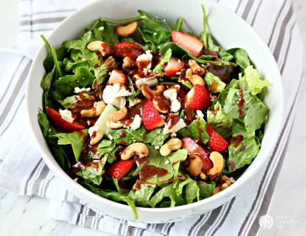 Strawberry Gorgonzola Salad with Cashews | Topped with homemade vinaigrette, loaded with spinach, romaine and Flavor!