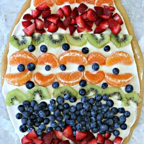 Sugar Cookie Easter Egg Fruit Pizza | Easy to make Easter treat. Cream Cheese frosting topped with your favorite fruits | Colorful Spring Dessert Ideas | TodaysCreativeLife.com