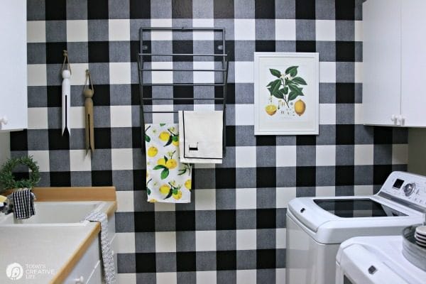 laundry room decorated in black and white