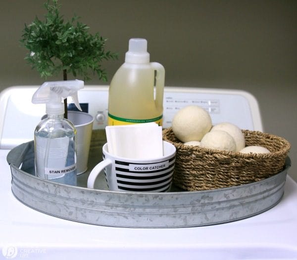 laundry products organized in galvanized metal tray