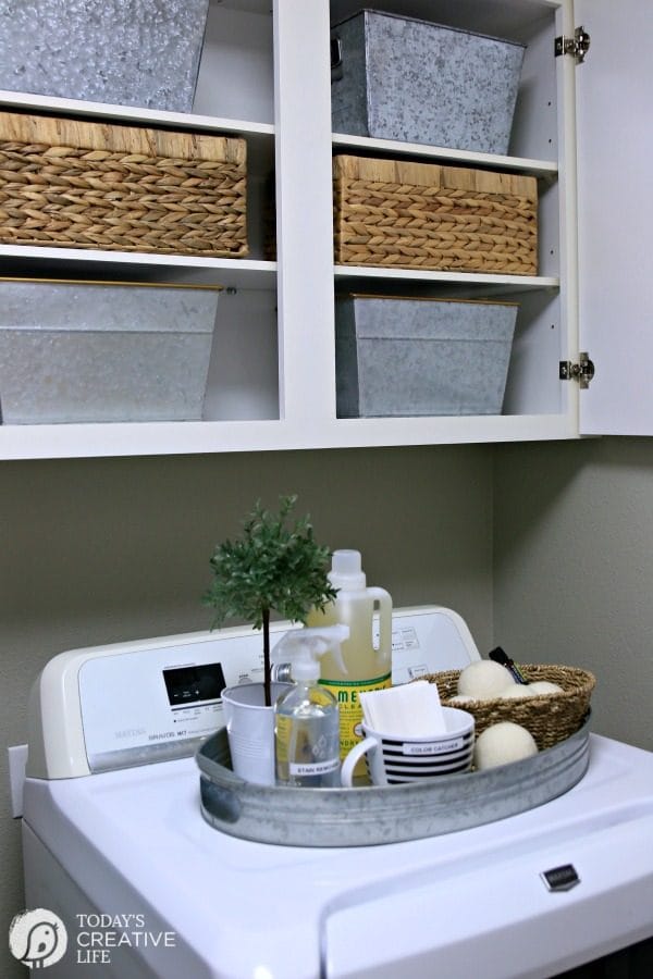 organizing baskets in a laundry room