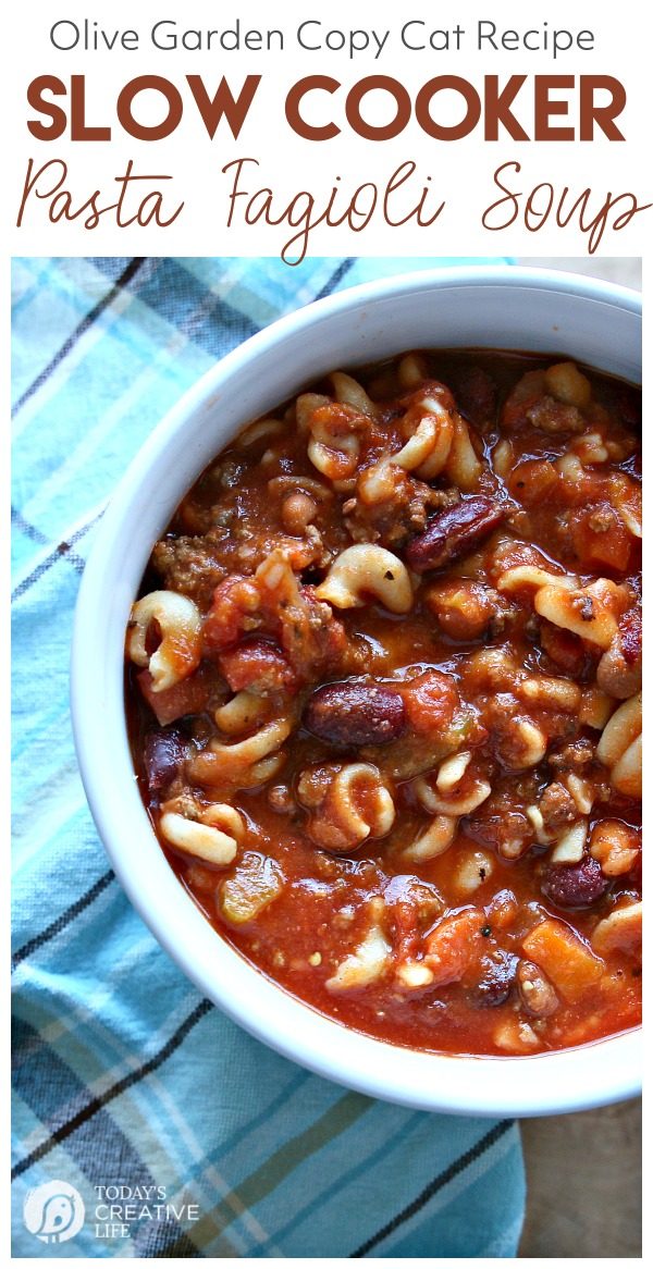 A bowl of Copy Cat Slow Cooker Pasta Fagioli Soup like Olive Garden full of pasta, beans, and veggies. 