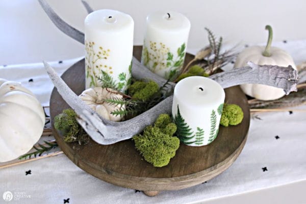 Table Centerpiece with Candles that ferns on them