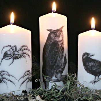 white candles with halloween images