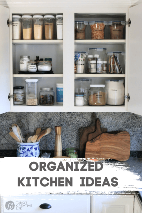 Kitchen cabinet full of organized pantry items