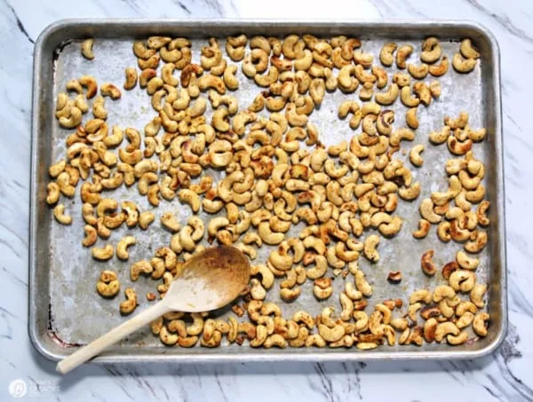 seasoned cashews on a baking pan 