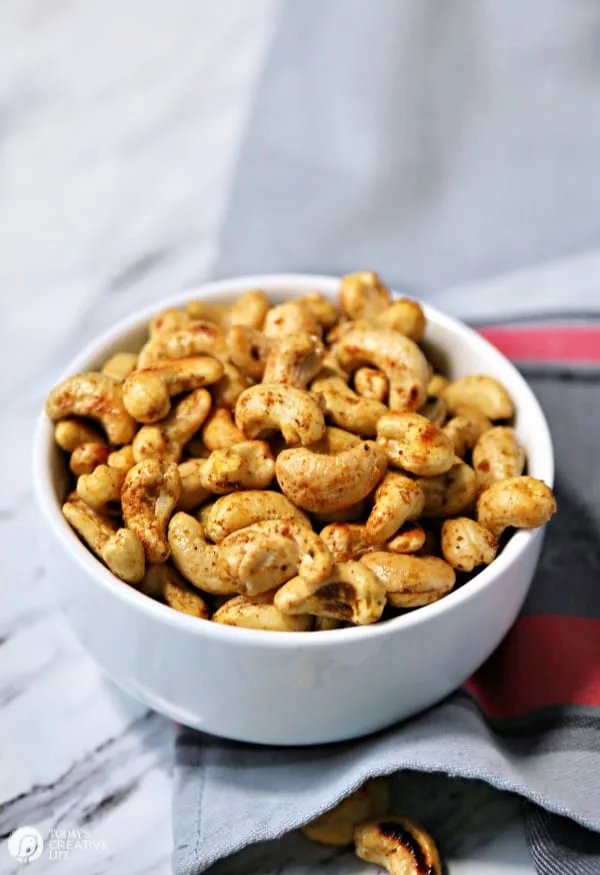 Spiced cashews in a white bowl