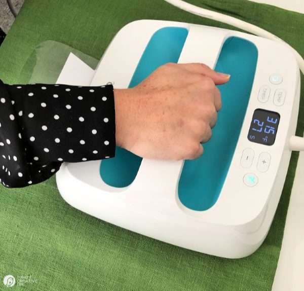Image of hand placed on EasyPress Heat Press