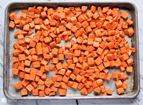 baking pan filled with cubed sweet potatoes 