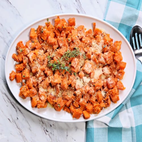 White platter with cubed roasted sweet potatoes