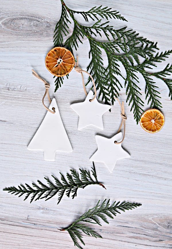 white clay christmas ornaments in the shape of a tree and star