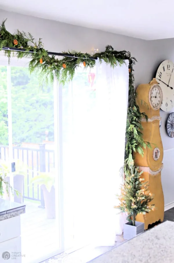 Decorated Sliding glass door decorated with cedar garland.